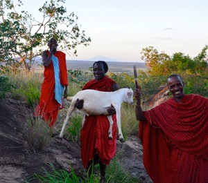 The Maasai men before suffocating the goat. The blue bin was used to but the goat’s organs in to cook later.