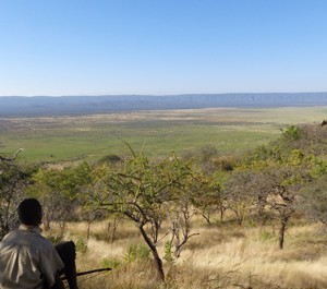Marcel on our hike down from Gederu Rock holding his bow and arrow
